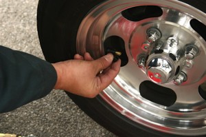 Check pressure when the tires are cold. If you have to drive to a gas station for air, choose one within a mile from the driveway or parking spot. Start by removing the cap on the tire valve.