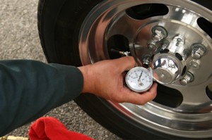 Tire gauges come in all manner of types and sizes. The key is to use the same gauge all the time for consistency. Push the tire pressure gauge down onto the valve and hold until it gives a reading. The one at the gas station will always be broken. 